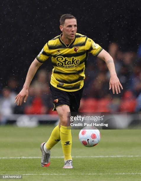 Dan Gosling of Watford FC runs with the ball during the Premier League match between Watford and Leicester City at Vicarage Road on May 15, 2022 in...