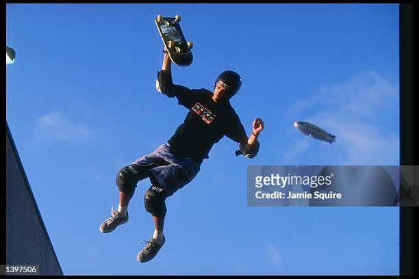 Tony Hawk and his skateboard hang in the air during the ESPN X-Games in San Diego, California.