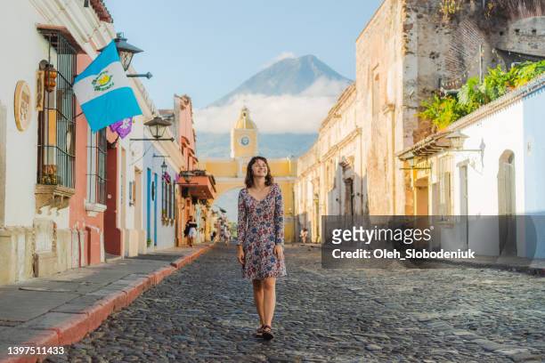 woman walking in antigua - guatemala city bildbanksfoton och bilder
