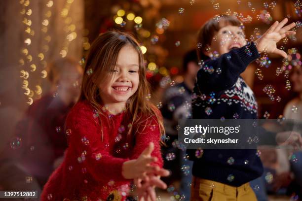 happy kids having fun during new year's eve at home. - new year's eve children stock pictures, royalty-free photos & images