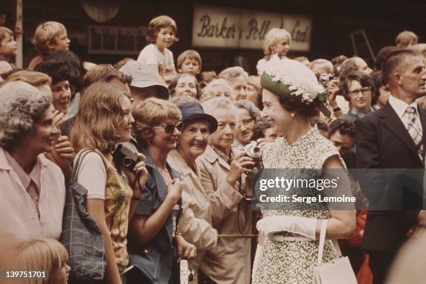 Queen Elizabeth II meets the crowd during her visit to New Zealand, 1977.