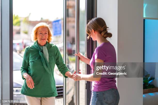 entrance door - entering hospital stock pictures, royalty-free photos & images