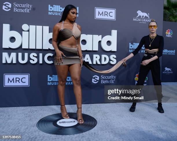 Megan Thee Stallion and Cara Delevingne attend the 2022 Billboard Music Awards at MGM Grand Garden Arena on May 15, 2022 in Las Vegas, Nevada.