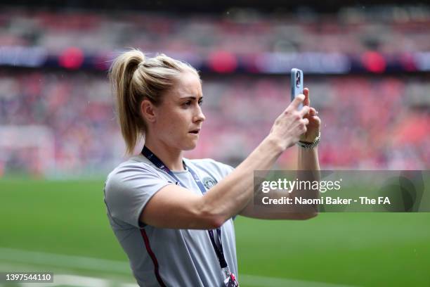 Steph Houghton of Manchester City takes a photograph on her phone during the Vitality Women's FA Cup Final match between Chelsea Women and Manchester...