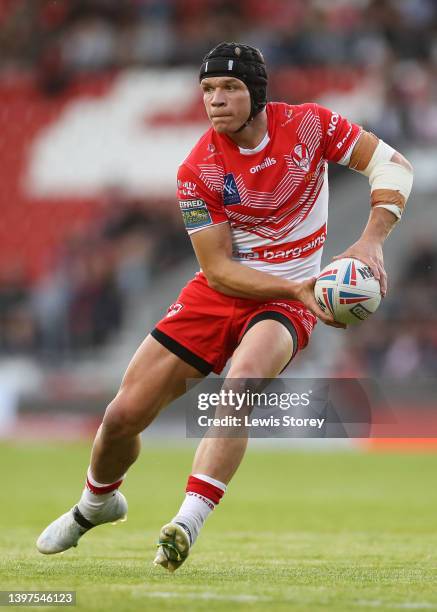 Jonny Lomax of St Helens runs with the ball during the Betfred Super League Round 12 match between St Helens and Hull FC at Totally Wicked Stadium on...