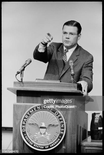 View of US Secretary of Defense Robert McNamara as he points from a lectern an unspecified press conference, Washington DC, February 5, 1963.