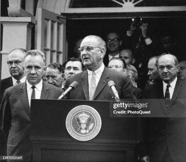 At the Glassboro Summit Conference, American President Lyndon B Johnson speaks from a lectern; with him is Soviet Premier Alexey Kosygin , Glassboro,...