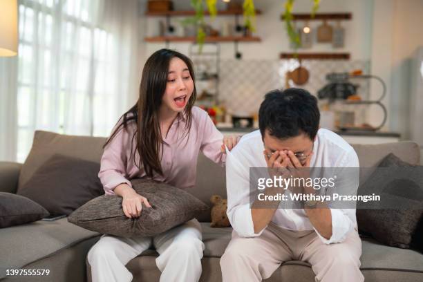 angry millennial couple arguing shouting blaming each other of problems - asian couple arguing stock-fotos und bilder