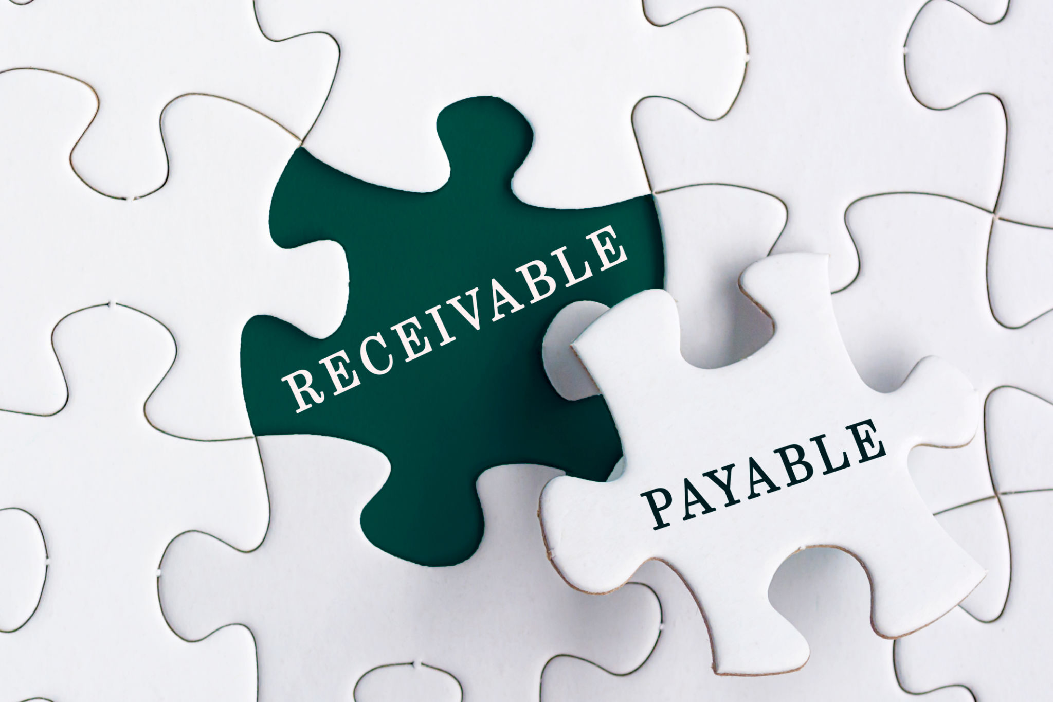 Receivable and payable text on Jigsaw Puzzle. Accounting concept Receivable and payable text on Jigsaw Puzzle. Accounting concept