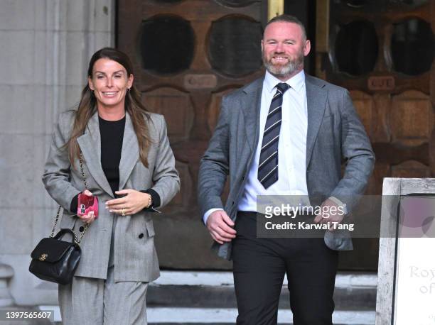 Coleen Rooney and Wayne Rooney depart the Royal Courts of Justice, Strand on May 16, 2022 in London, England. Coleen Rooney, wife of Derby County...