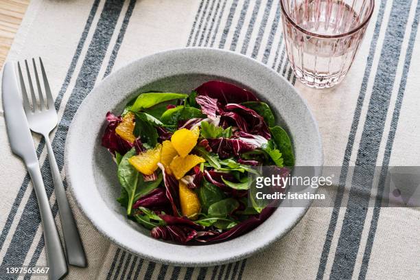 plant based vegan meal. salad with fresh vegetables, herbs, fruit - couve rouxa imagens e fotografias de stock