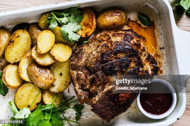 baked pork meat with baby potatoes - cultivated meat stock pictures, royalty-free photos & images