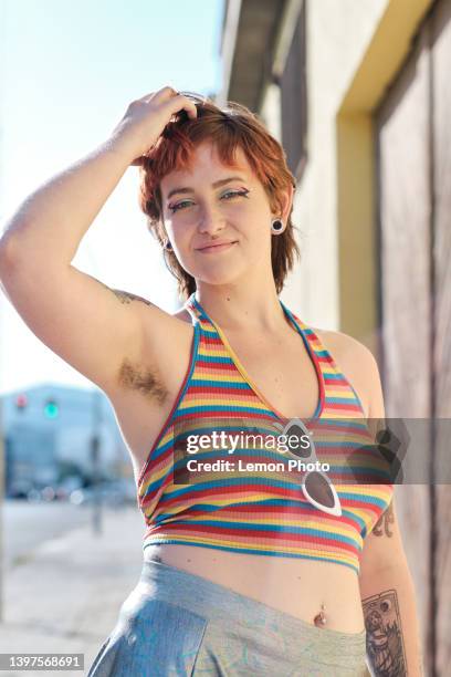 half body shoot of a young beautiful woman looking at the camera on a sunny day - armpit hair stock pictures, royalty-free photos & images