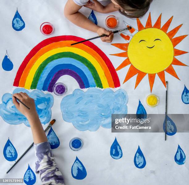 children painting - kids rainbow art stock pictures, royalty-free photos & images