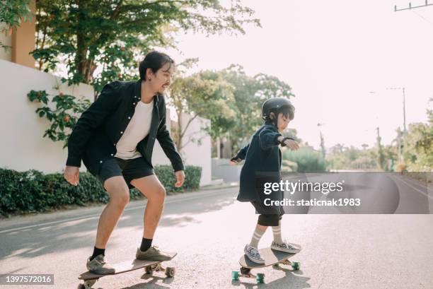 happy family surf skate board player enjoy in the outdoor. - father longboard stock pictures, royalty-free photos & images