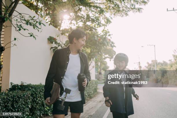 happy family surf skate board player enjoy in the outdoor. - father longboard stock pictures, royalty-free photos & images