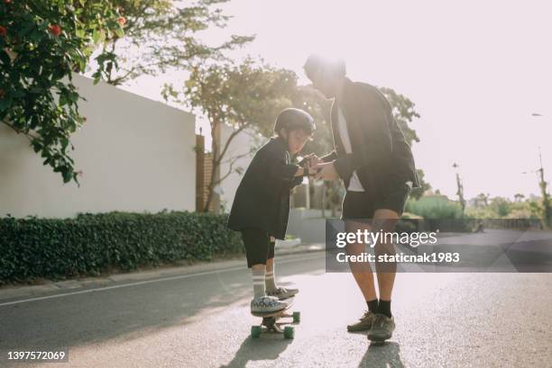 happy family surf skate board player enjoy in the outdoor. - father longboard stock pictures, royalty-free photos & images