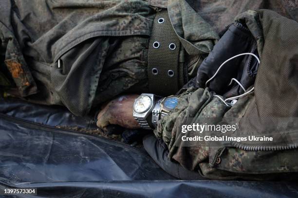 Several watches are seen on hand of dead Russian soldier, who died in settlements north of Kharkiv, on May 14, 2022 in Kharkiv, Ukraine. In total, on...
