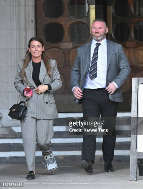 Coleen Rooney and Wayne Rooney depart the Royal Courts of Justice, Strand on May 16, 2022 in London, England. Coleen Rooney, wife of Derby County...