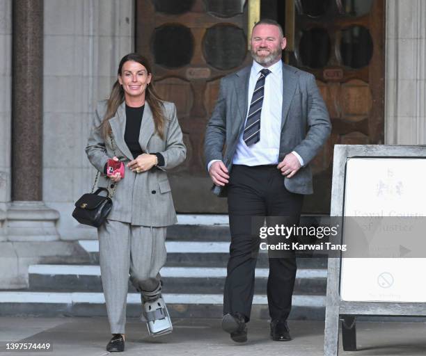 Coleen Rooney and Wayne Rooney depart the Royal Courts of Justice, Strand on May 16, 2022 in London, England. Coleen Rooney, wife of Derby County...