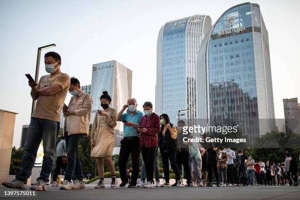 The residents line up for nucleic test for the Covid-19 coronavirus on May 16, 2022 in Wuhan, Hubei Province, China. According to local media...