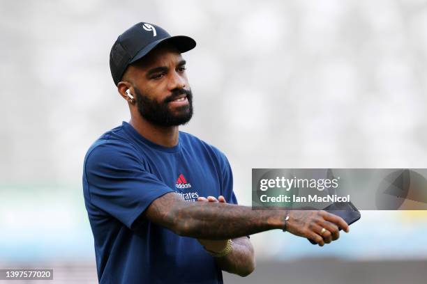 Alexandre Lacazette of Arsenal looks on while inspecting the pitch prior to the Premier League match between Newcastle United and Arsenal at St....