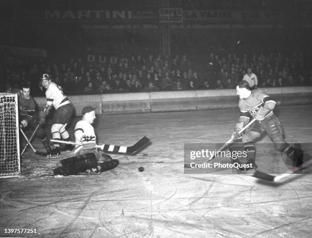 View of on-ice action during a hockey game between the Montreal Canadiens and the Detroit Red Wings, Montreal, Canada, April 30, 1938. (Photo by US...