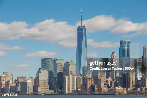 view of skyscrapers against cloudy sky,new york,united states,usa - one world observatory stock pictures, royalty-free photos & images