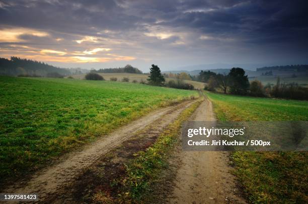 scenic view of agricultural field against sky during sunset - kuchar stock pictures, royalty-free photos & images