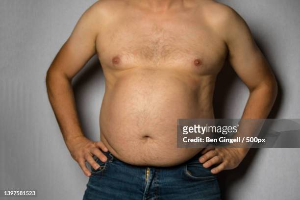 a studio photograph of an overweight caucasian man,london,united kingdom,uk - pot belly fotografías e imágenes de stock