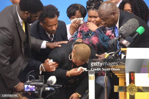 Attorney Benjamin Crump comforts the family of 86-year-old Ruth Whitfield who was killed during a mass shooting at Tops market on May 16, 2022 in...