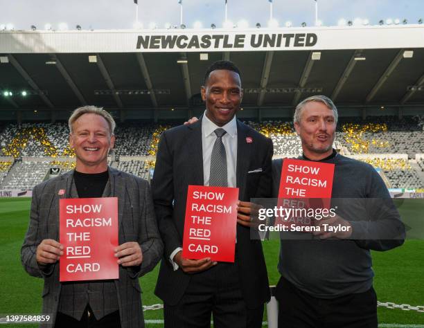 Former players John Beresford, Shaka Hislop, Lee Clark pose with some Show racism the red card signs before the Premier League match between...