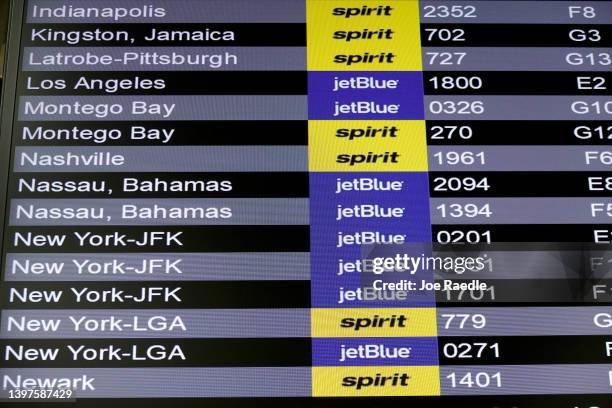 JetBlue Airlines and Spirit Airlines are seen on the departure board in the Fort Lauderdale-Hollywood International Airport on May 16, 2022 in Fort...