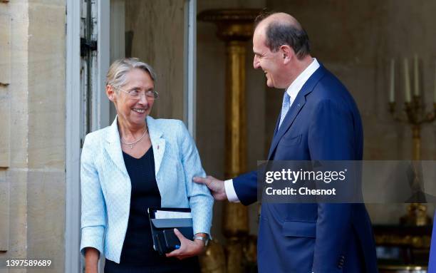 France's outgoing Prime Minister Jean Castex welcomes his successor, former Labour Minister Elisabeth Borne in the courtyard of the Hotel Matignon on...