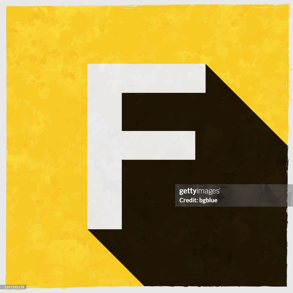 文字 F. テクスチャ付きの黄色の背景に長い影が付いたアイコン