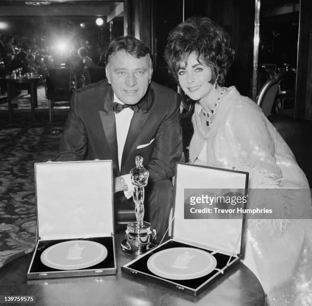 Married actors Elizabeth Taylor and Richard Burton attend the BAFTA Awards dinner at Grosvenor House in London, 26th April 1967. They won the Best...