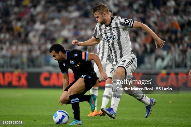 Pedro Rodriguez of SS Lazio compete for the ball with Matthijs De Ligt of Juventus during the Serie A match between Juventus and SS Lazio at Allianz...