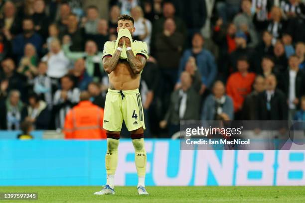 Ben White of Arsenal looks dejected after scoring an own goal which lead to the first goal for Newcastle United during the Premier League match...