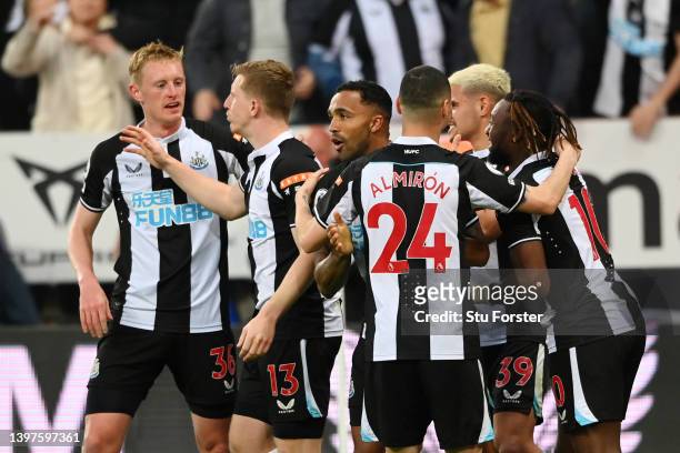 Callum Wilson of Newcastle United celebrates with teammates after Ben White of Arsenal scored an own goal which lead to the first goal for Newcastle...