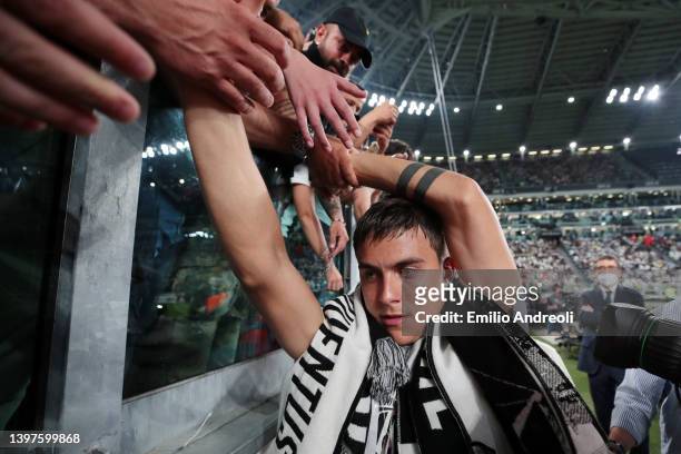 Paulo Dybala of Juventus interacts with fans after being substituted off during the Serie A match between Juventus and SS Lazio at Allianz Stadium on...