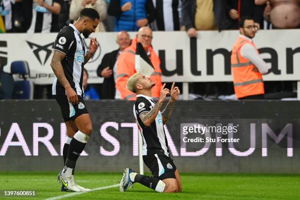 Bruno Guimaraes of Newcastle United celebrates with teammate Jamaal Lascelles after scoring their team's second goal during the Premier League match...