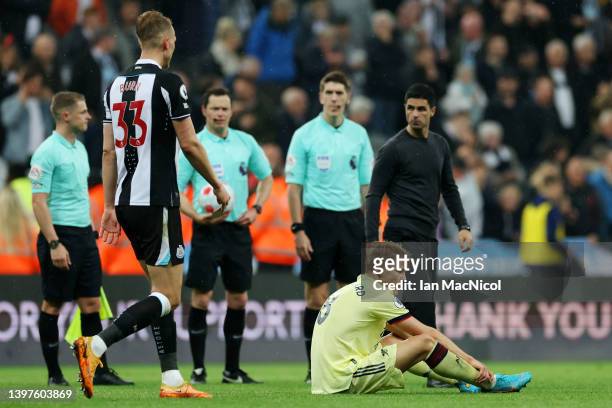 Martin Oedegaard of Arsenal looks dejected following their sides defeat in the Premier League match between Newcastle United and Arsenal at St. James...