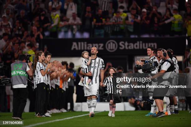 Giorgio Chiellini of Juventus is greeted by the team and fans at the end of the Serie A match between Juventus and SS Lazio at Allianz Stadium on May...