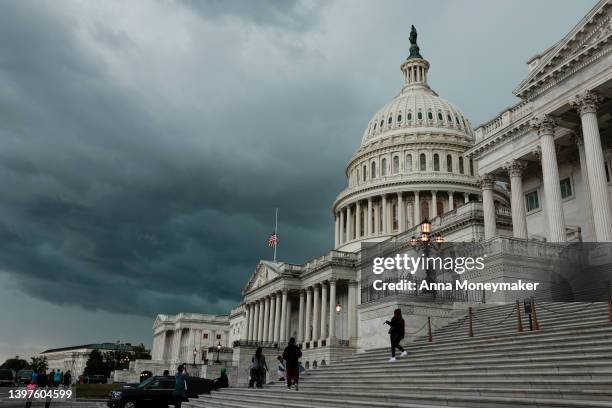 Storm cloud hangs over the U.S. Capitol Building on May 16, 2022 in Washington, DC. This week the U.S. Senate is expected to take up a vote on a $40...