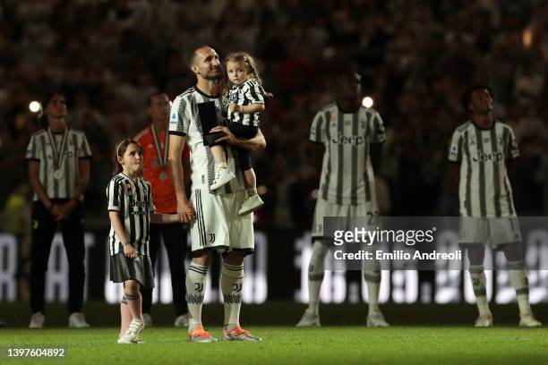 Giorgio Chiellini of Juventus receives applauds in a tribute from players, staff and fans as he walks the pitch with his daughters Nina and Olivia...