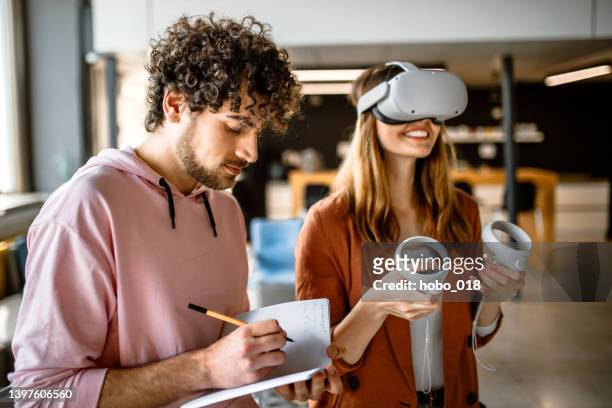 group of university students in the office using vr simulator headsets, having fun - employee engagement virtual stock pictures, royalty-free photos & images