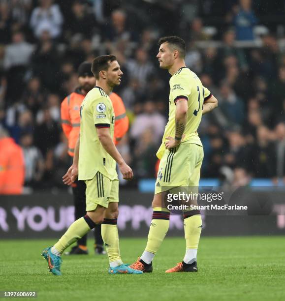 Cedric and Granit Xhaka of Arsenal after the Premier League match between Newcastle United and Arsenal at St. James Park on May 16, 2022 in Newcastle...
