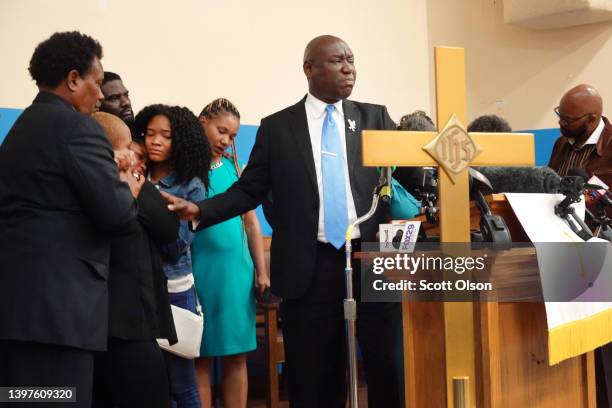 Attorney Benjamin Crump comforts the family of 86-year-old Ruth Whitfield who was killed during a mass shooting at Tops market on May 16, 2022 in...