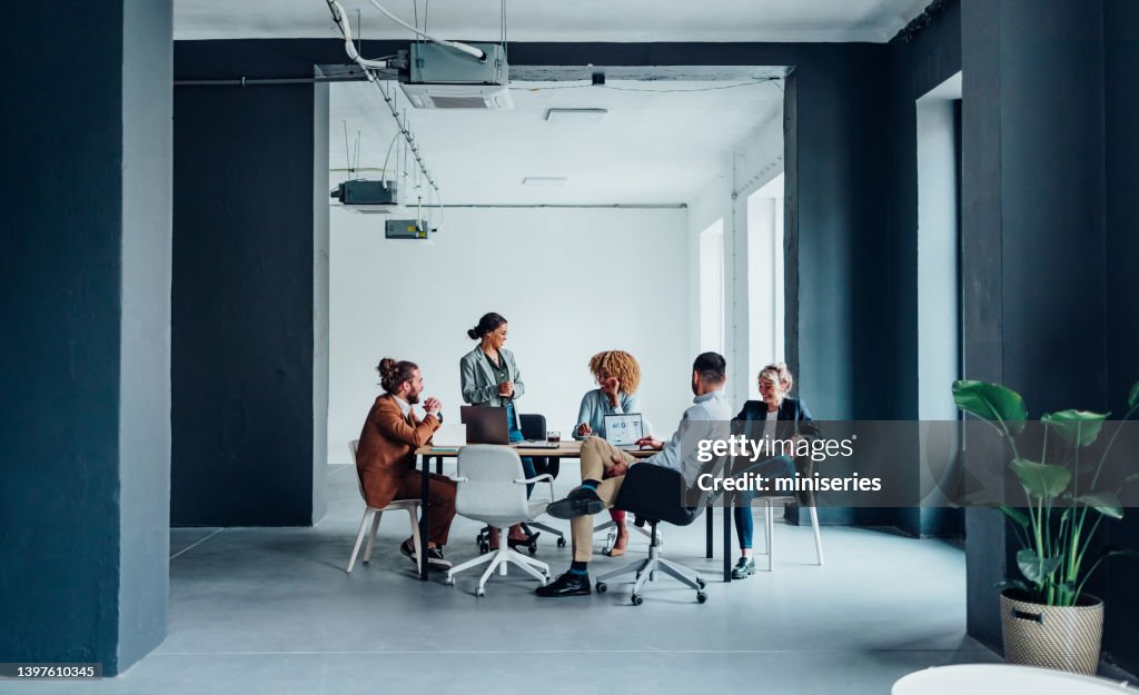 Group Of Businesspeople Having a Meeting At Their Modern Company