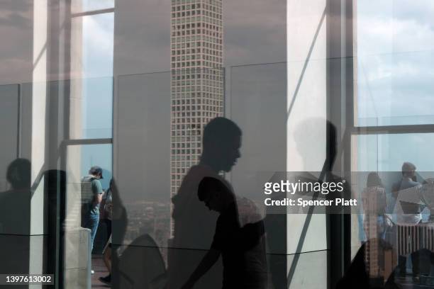 The luxury supertall condo tower, 432 Park Avenue, is reflected in a window as it stands in Midtown Manhattan on May 16, 2022 in New York City....